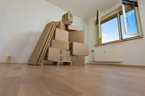 Camden movers handling furniture in a narrow London street