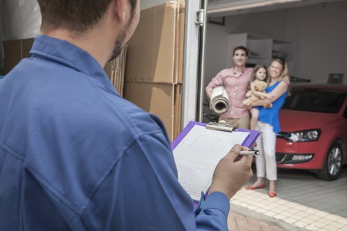 Removal team loading items for a Camden home move