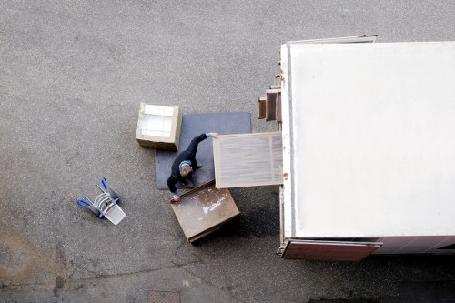 Furniture pick-up service removing a sofa in Camden
