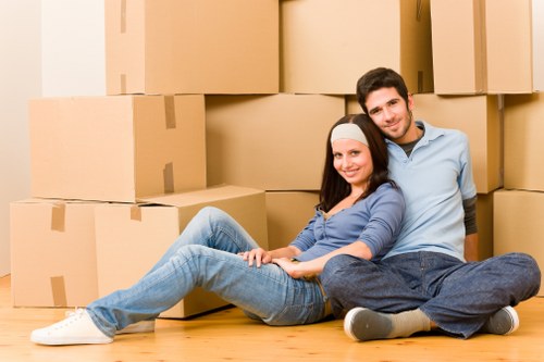 Packed household boxes and moving equipment ready for transport