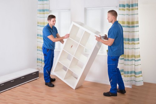 Professional movers loading items into a removal van in Camden