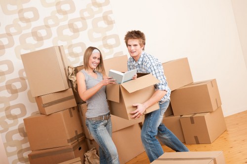 Professional movers loading furniture during an urgent Camden relocation
