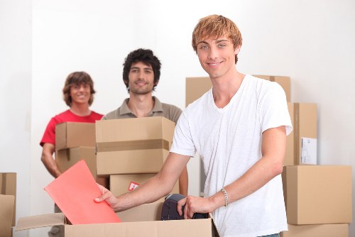 Office furniture removals in Camden with desks and chairs being relocated